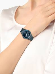 Lacoste women's watch with blue mesh bracelet worn on wrist