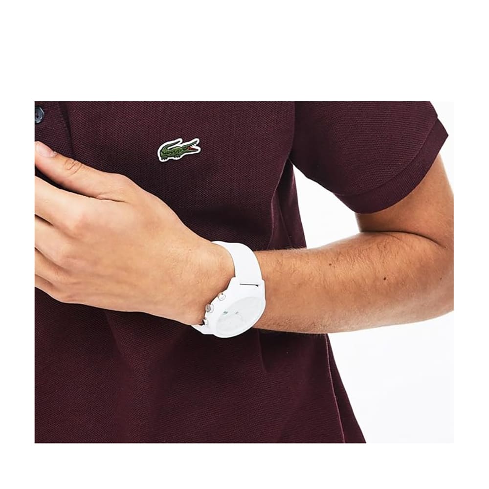 Lacoste 2010974 watch worn on wrist showing white dial and rubber strap in lifestyle setting