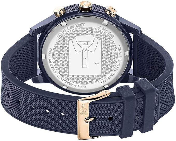Lacoste watch caseback showing polo shirt logo with blue rubber strap and rose gold buckle