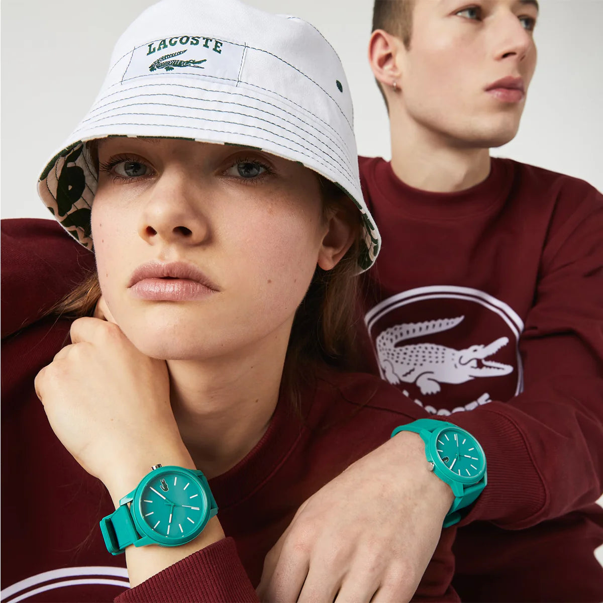 Lacoste 2011192 green dial watch worn on wrist with silicone band