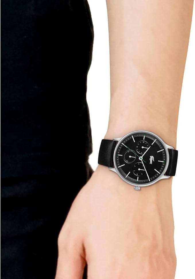 Lacoste black watch on wrist showing dial detail and strap