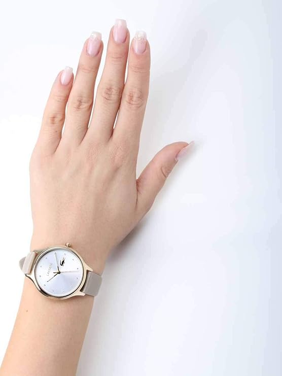 Lacoste Constance watch worn on wrist showing white dial with diamond indices