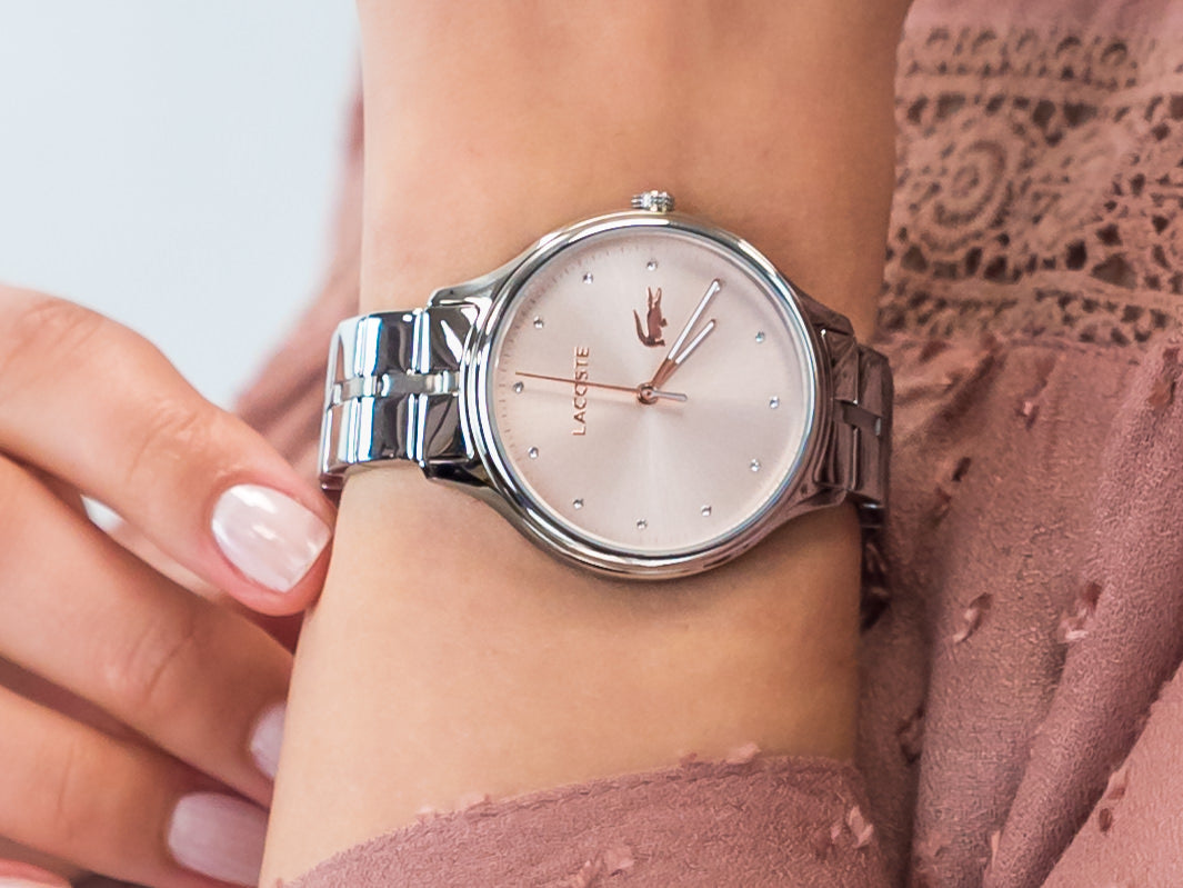 Lacoste Constance women's watch worn on wrist with stainless steel bracelet and rose gold dial