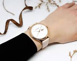 Lacoste Constance watch worn on wrist with pink leather strap