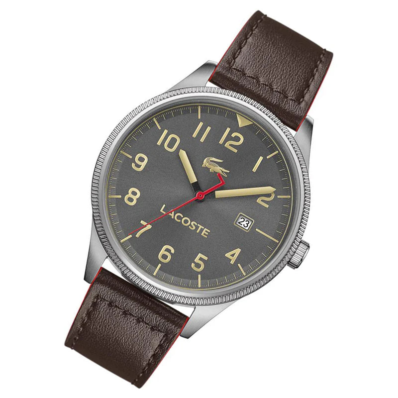 Lacoste Continental watch worn on wrist, displaying grey dial with gold and red hands