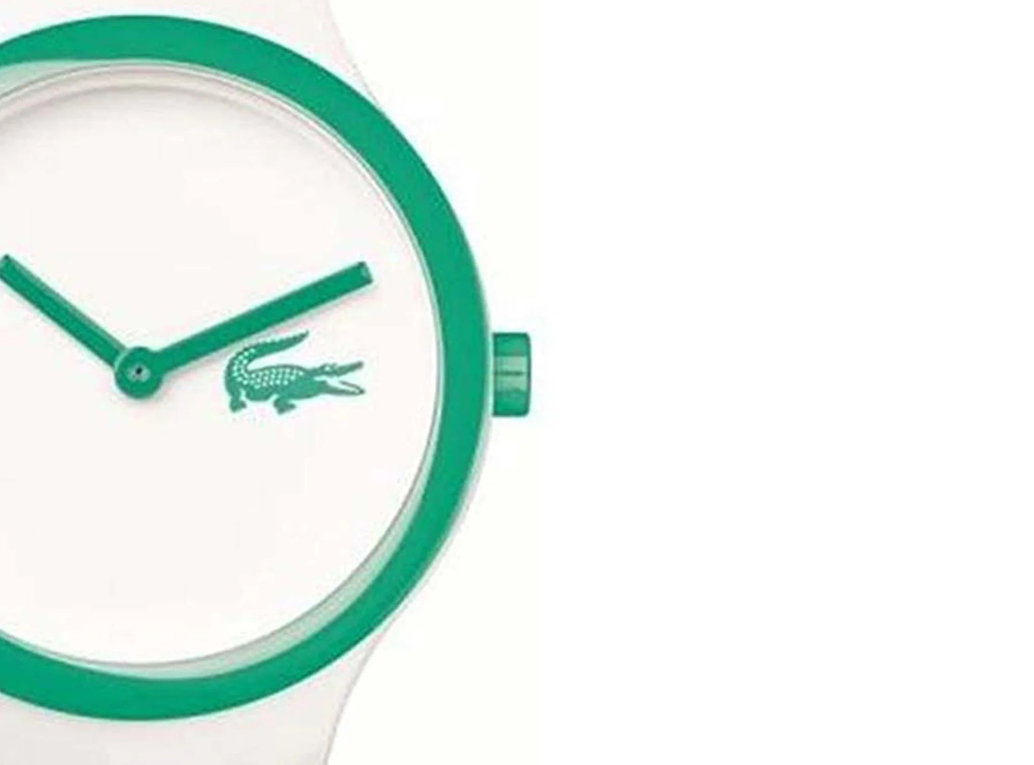 Close-up of dial showing Lacoste crocodile logo and green hands on white background