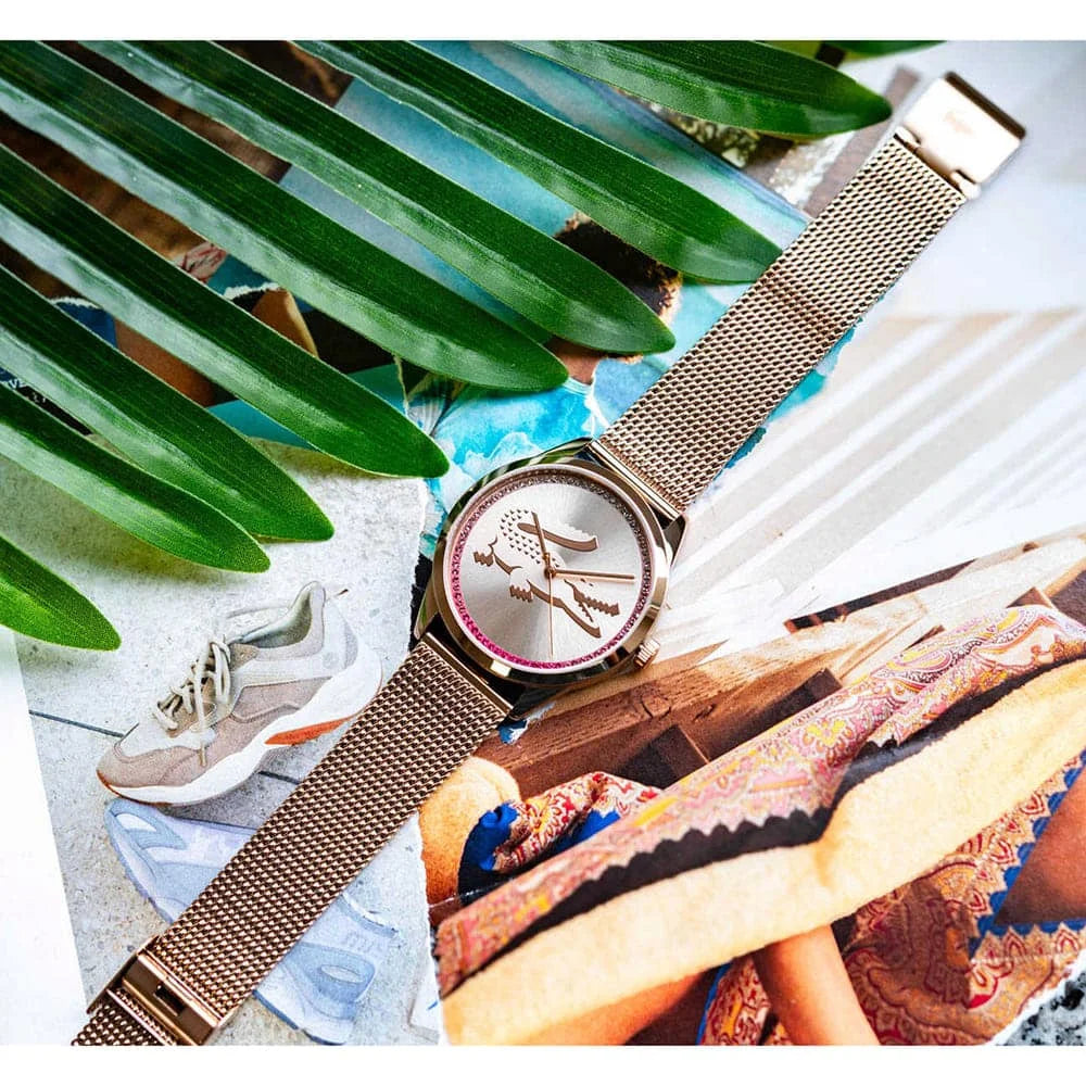 Lacoste Ladycroc watch worn on wrist with carnation gold dial and mesh band