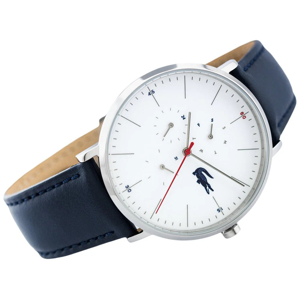 Angled view of Lacoste Moon watch showing silver case, white dial, and navy leather strap