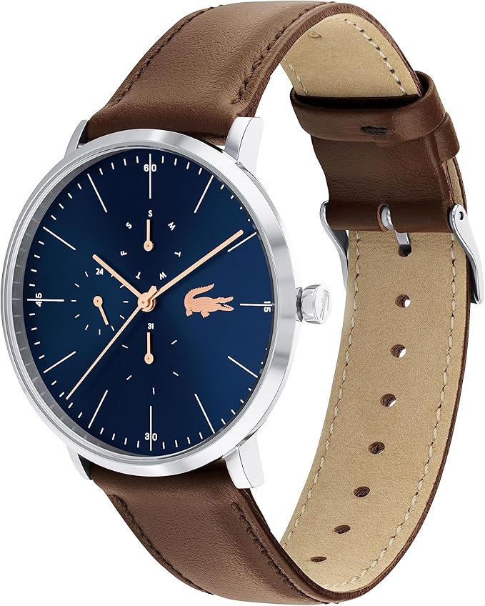 Lacoste Moon Ultra Slim watch at angle showing silver case, navy dial with rose gold accents, and brown leather strap with beige lining