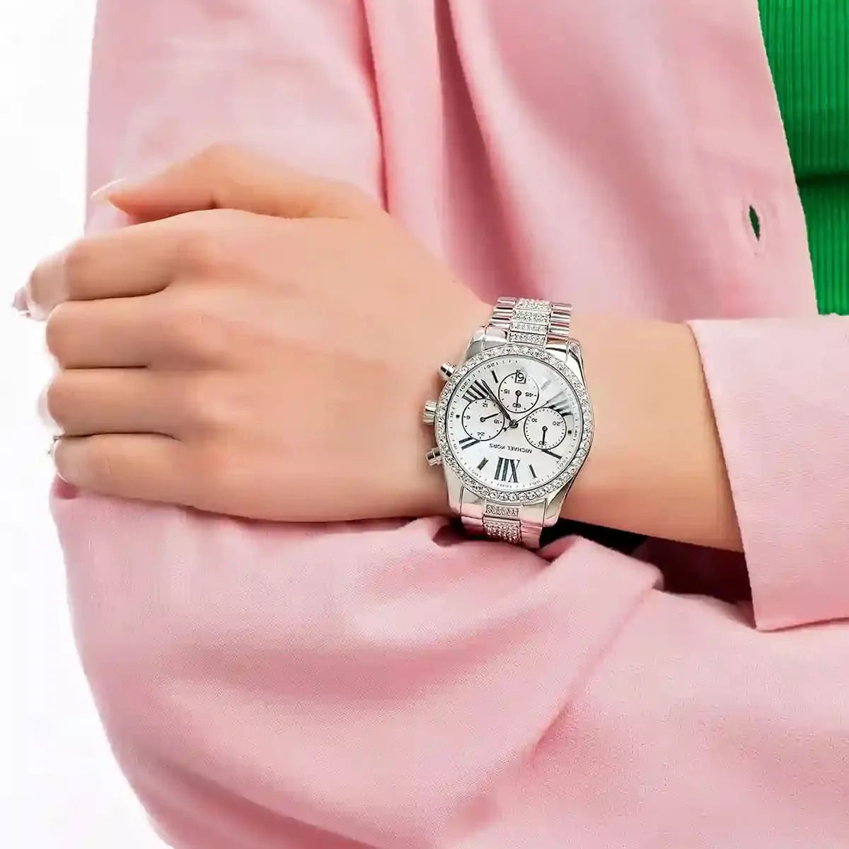 Lexington Pavé watch worn on wrist with silver bracelet and chronograph dials