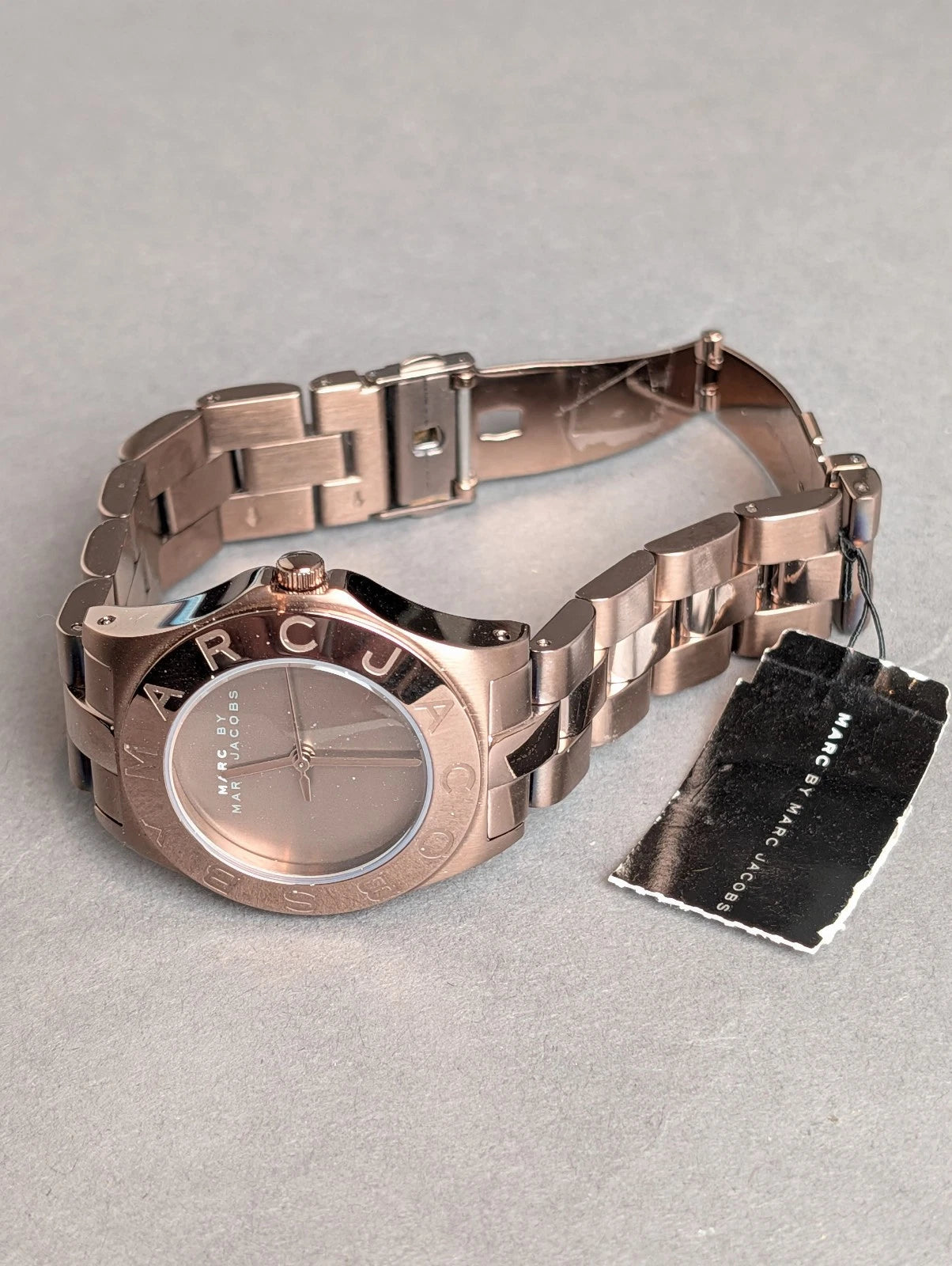 Marc by Marc Jacobs Amy rose gold watch with bracelet and product packaging displayed flat