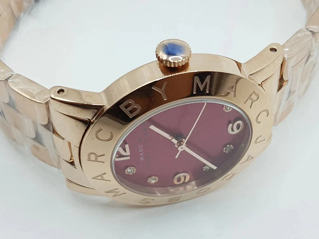 Marc by Marc Jacobs Amy watch at angle showing rose gold case and burgundy dial