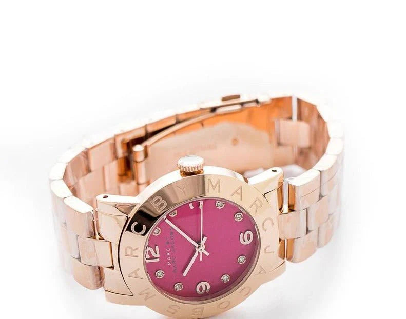 Marc by Marc Jacobs Amy rose gold watch worn on wrist with burgundy dial