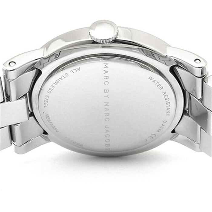 Close-up detail of watch caseback with engraved Marc by Marc Jacobs text