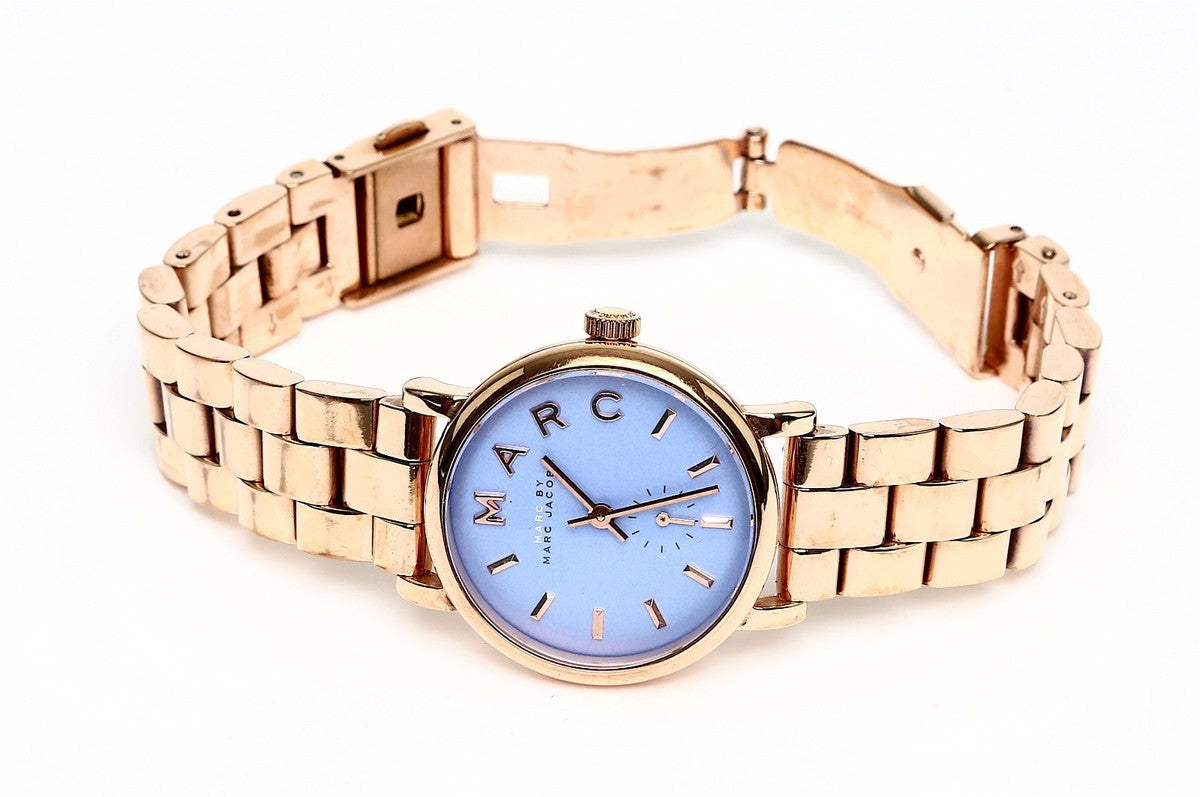Marc By Marc Jacobs Baker blue dial watch worn on wrist with rose gold bracelet