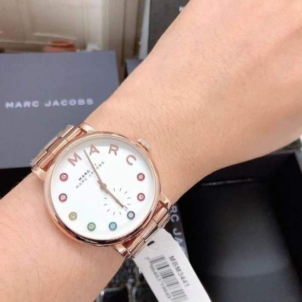 Marc by Marc Jacobs Baker white dial watch worn on wrist showing rose gold finish