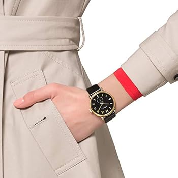 Marc by Marc Jacobs Baker MBM1269 watch worn on wrist with gold case and black dial visible