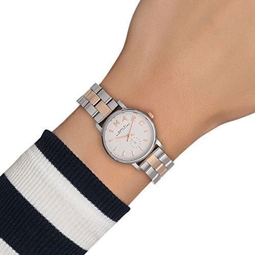 Marc by Marc Jacobs Baker watch worn on wrist showing white dial and two-tone metal bracelet