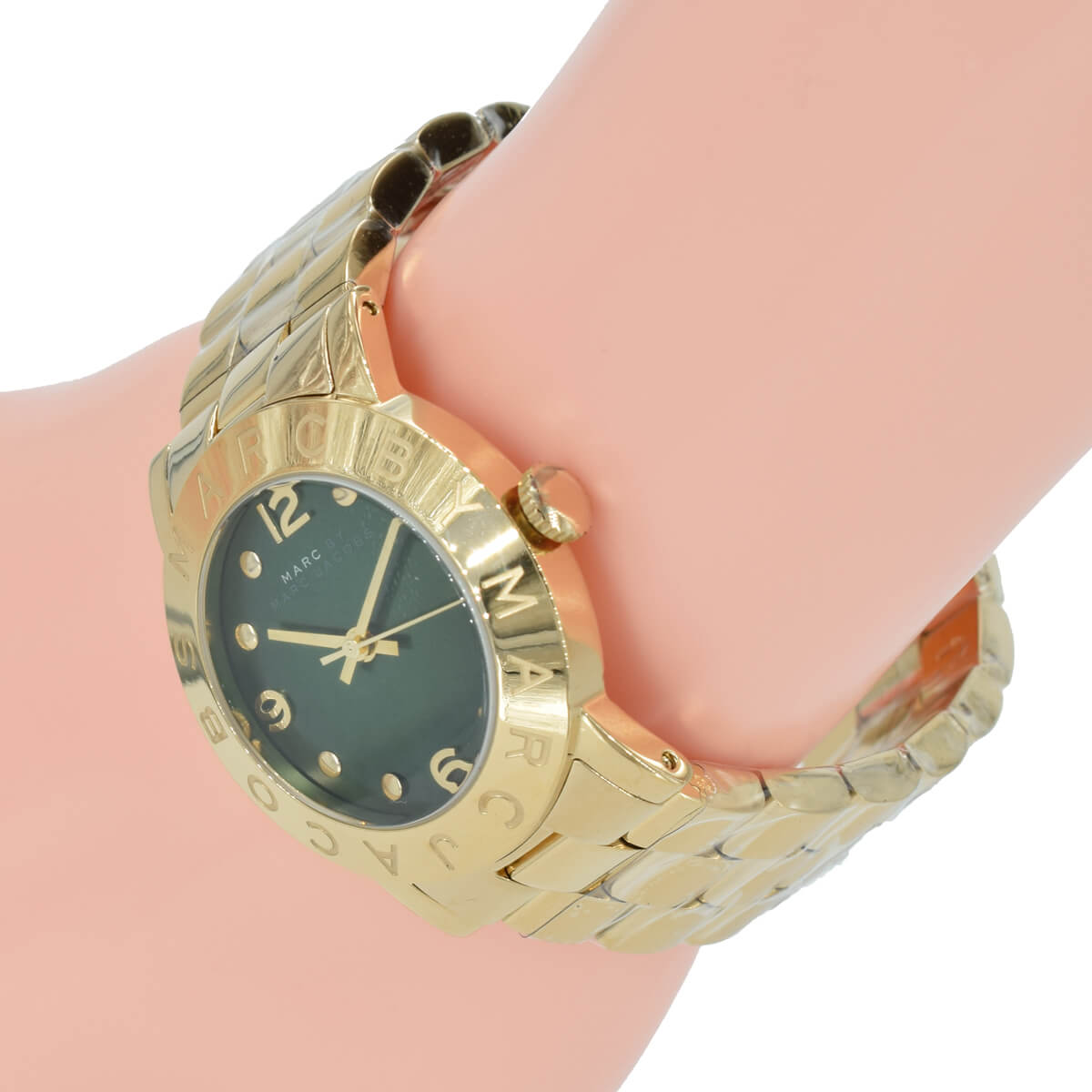 Side angle view of Marc by Marc Jacobs watch worn on wrist with gold bracelet
