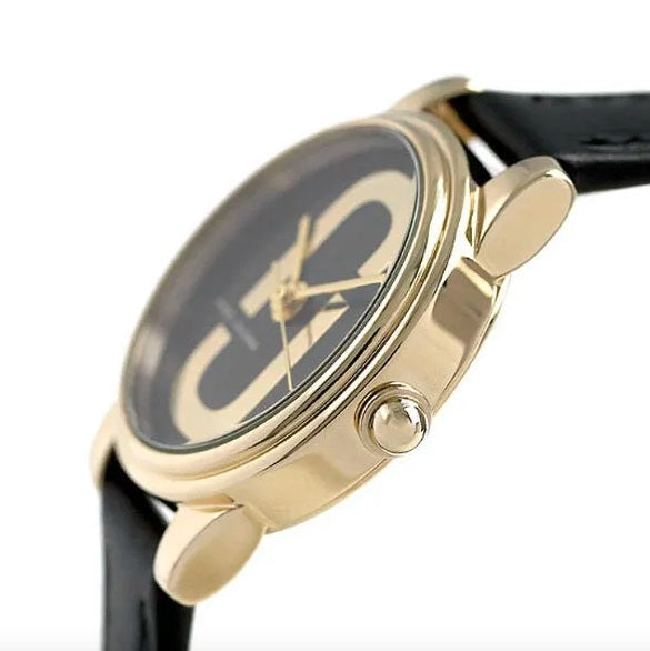 Side profile view of Marc Jacobs Corie watch with gold-tone case and crown