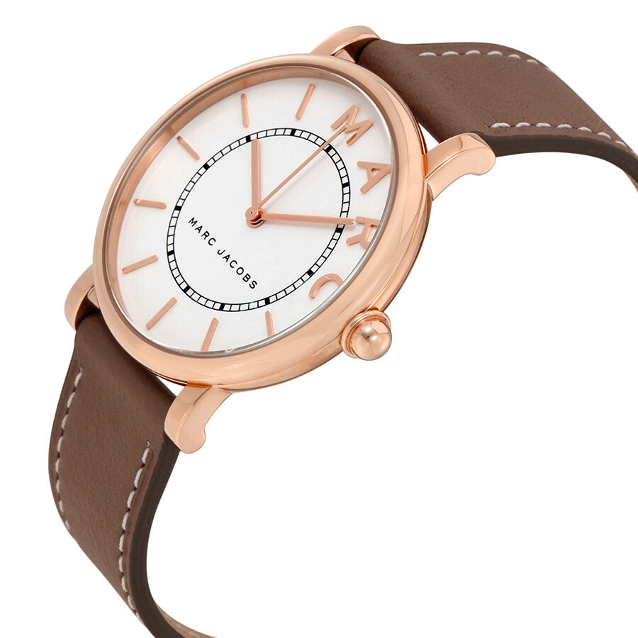 Marc Jacobs Roxy watch at angle showing silver dial, rose gold case, and cement leather strap