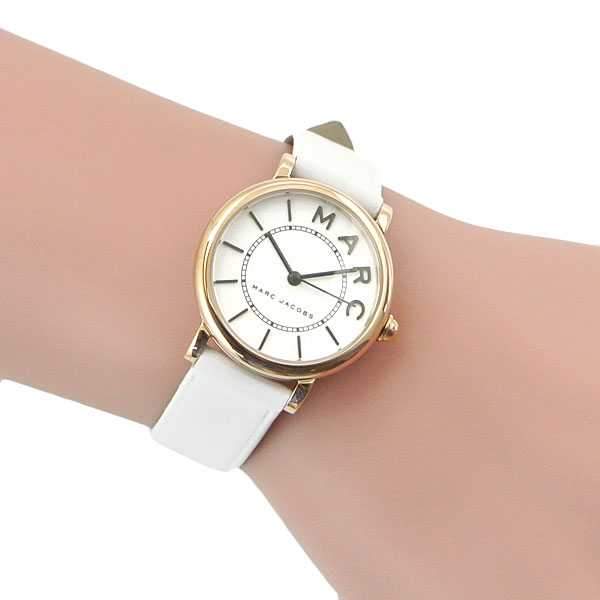 Marc Jacobs Roxy watch worn on wrist with white leather strap and rose gold case