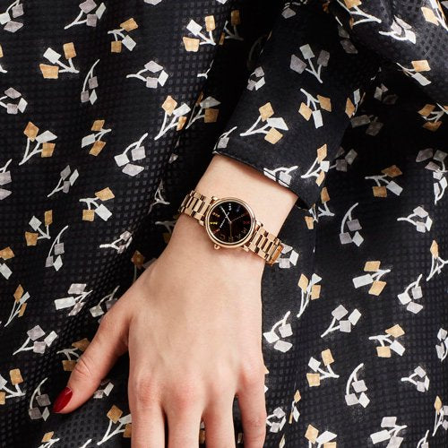 Marc Jacobs Roxy women's watch worn on wrist with rose gold bracelet and black dial