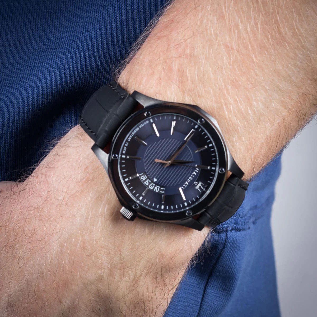 Maserati Circuito watch on wrist showing blue sunburst dial and black leather strap