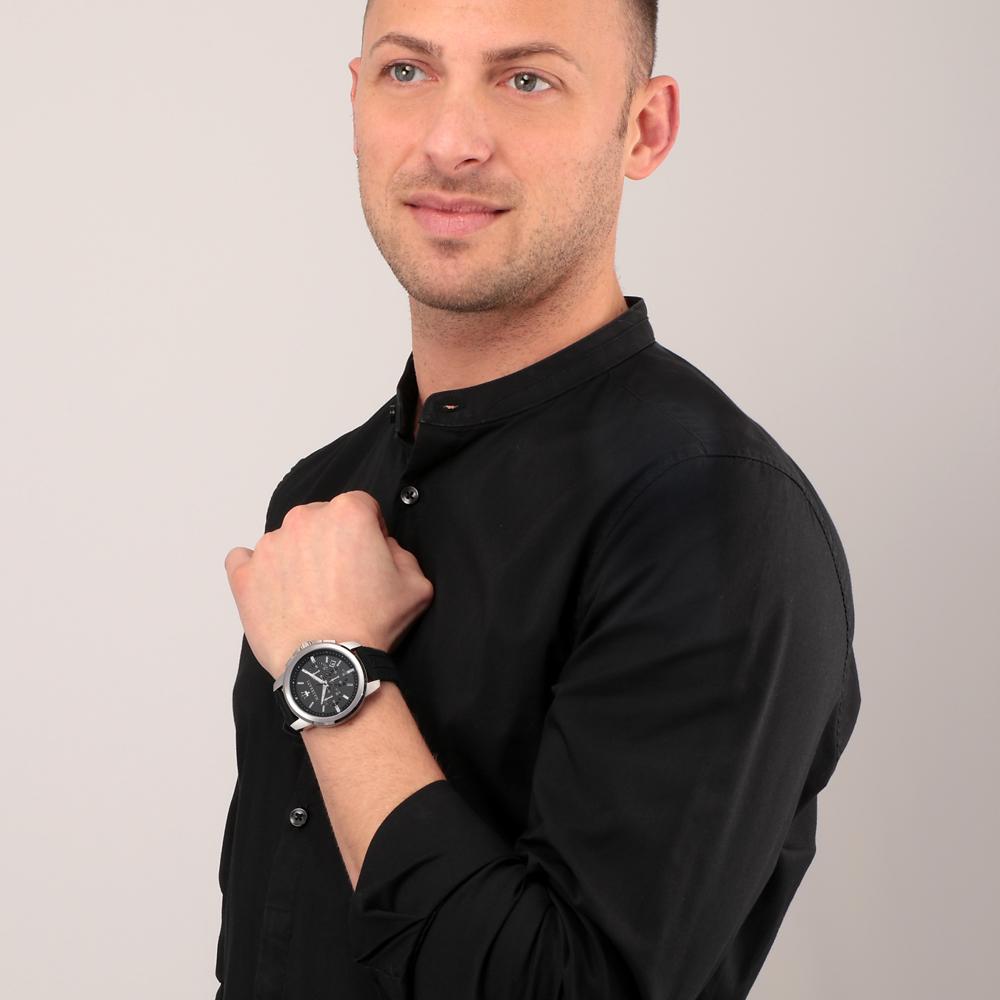 Maserati quartz watch worn on wrist of man in black shirt