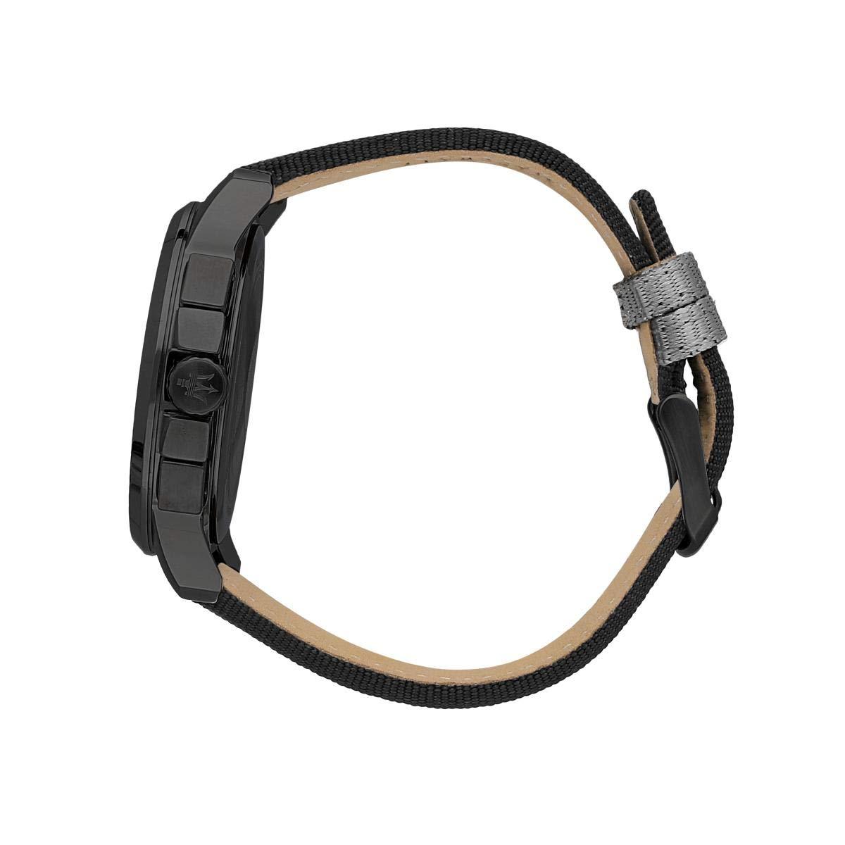 Black and gray striped fabric strap with buckle closure and tan leather lining