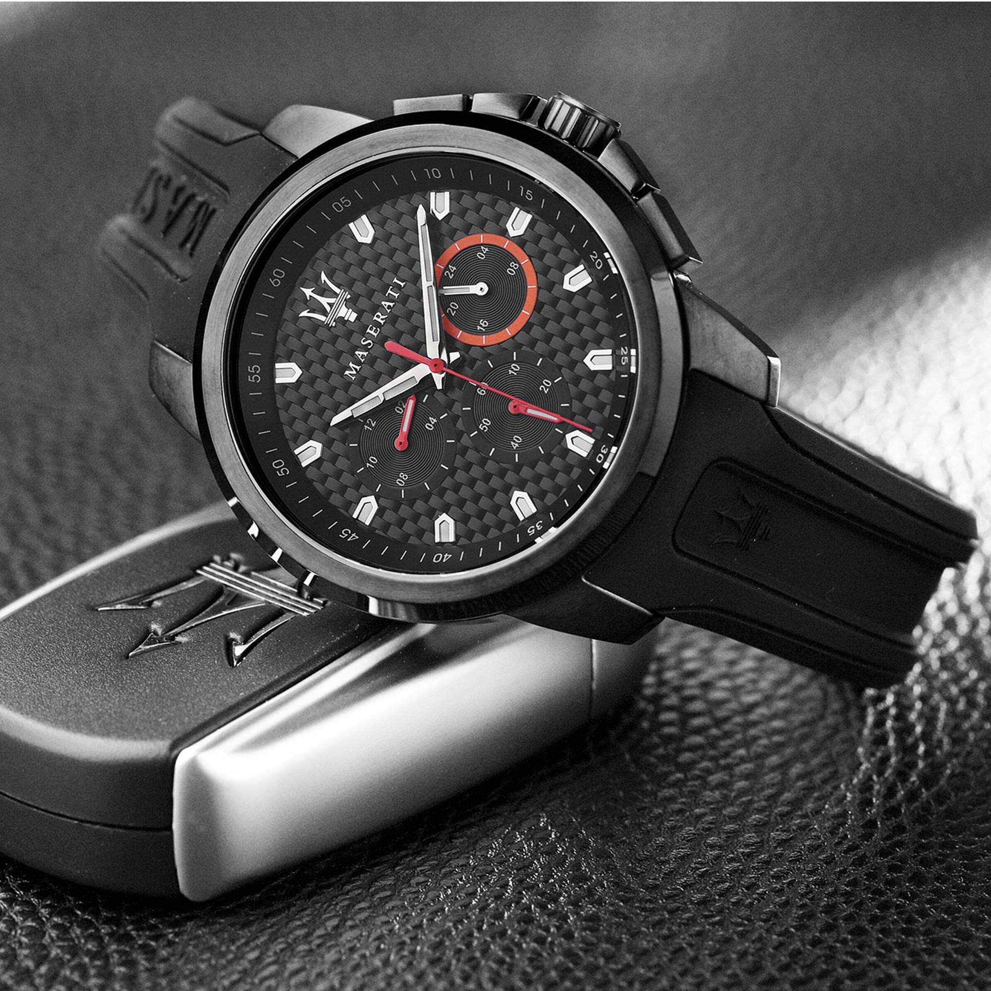 Angled view of Maserati Sfida chronograph with black textured dial and red subdials