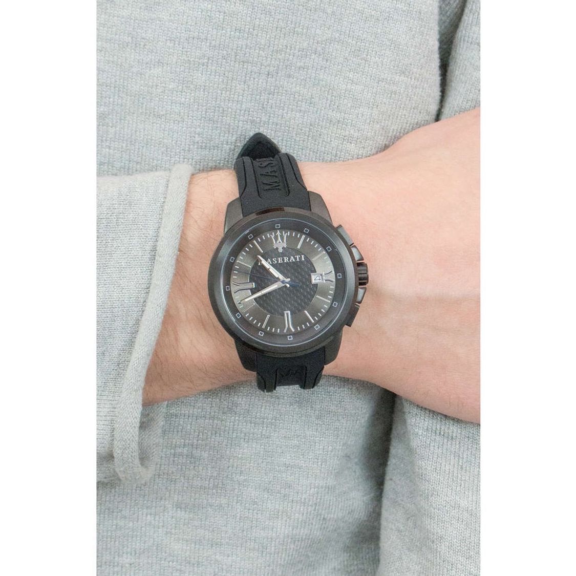 Maserati Sfida men's watch worn on wrist showing black dial with silver hands and date window