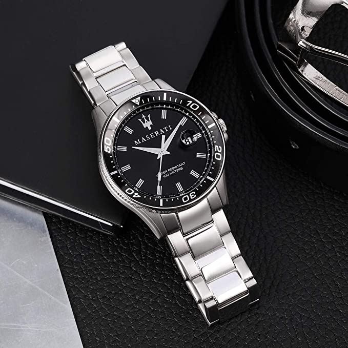 Maserati Sfida watch worn on wrist with black dial and silver stainless-steel bracelet