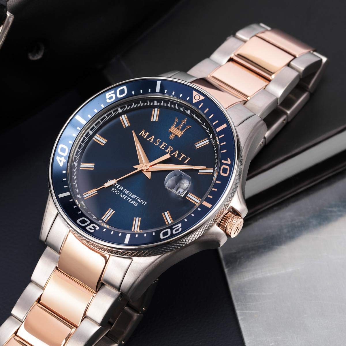 Maserati Sfida watch worn on wrist showing blue dial and two-tone bracelet