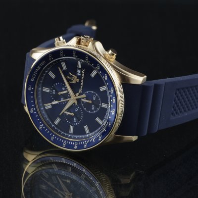 Maserati Sfida chronograph watch angled view showing gold tone case and navy strap with chronograph subdials