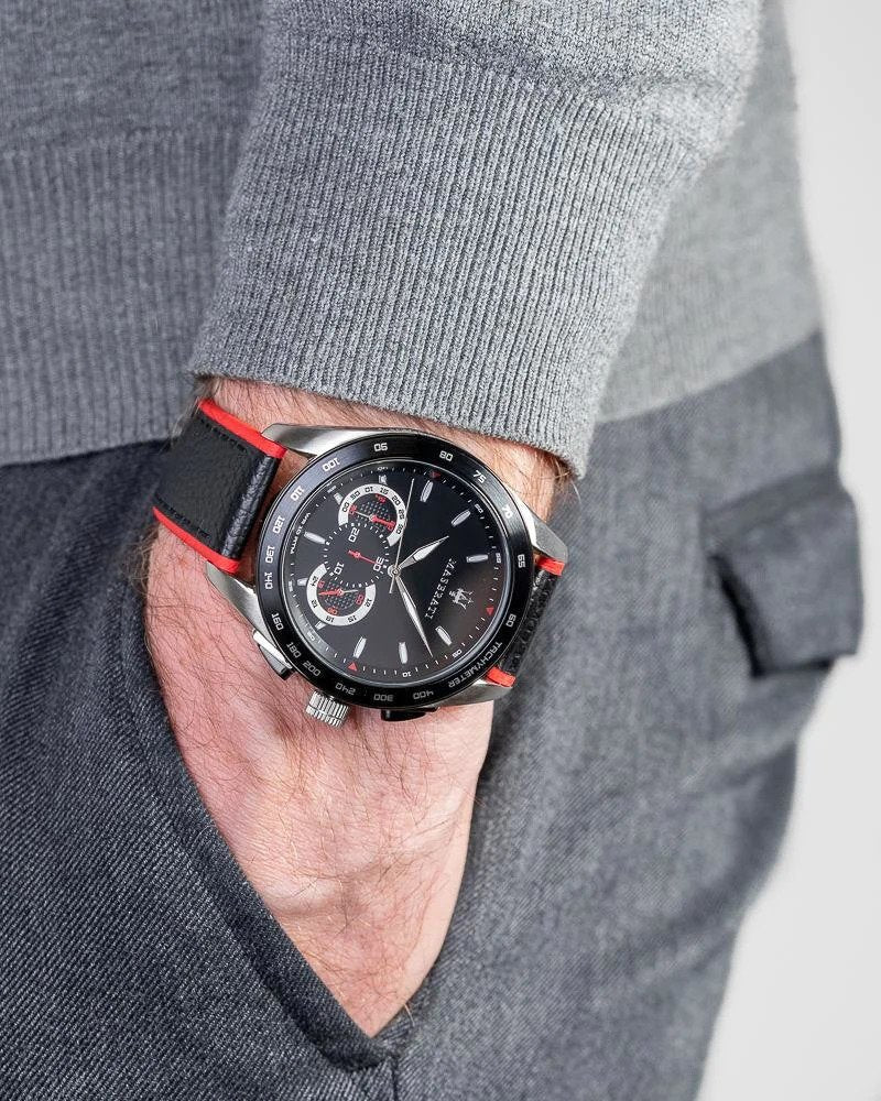 Maserati Traguardo chronograph watch worn on wrist with black leather red-trimmed strap