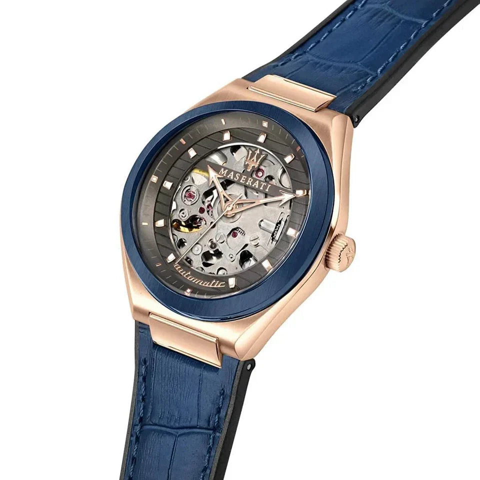 Angled view of Maserati Triconic watch showcasing rose gold case, skeleton dial and blue leather crocodile strap