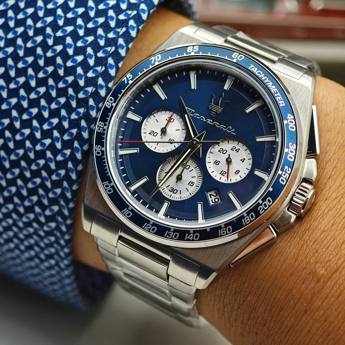 Maserati Velocità R8873652005 watch on wrist detail showing blue dial, chronograph hands, and date window