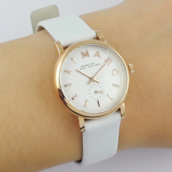 Marc by Marc Jacobs Baker watch worn on wrist showing white dial and white leather strap