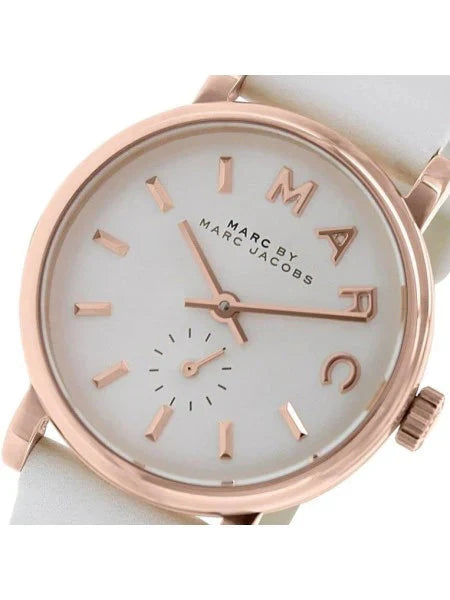 Close-up of Baker watch dial showing white face, rose gold numerals, hands, and subdial