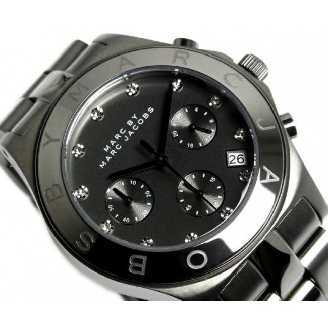 Close-up of Marc by Marc Jacobs Blade dial with black face, diamond indices, chronograph subdials and date window
