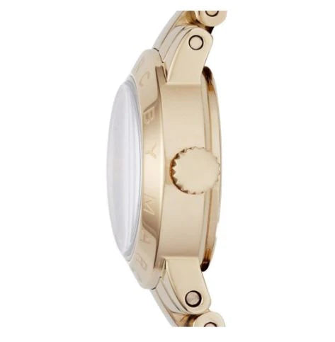 Side profile of Amy Dinky watch showing case depth and gold-tone steel construction
