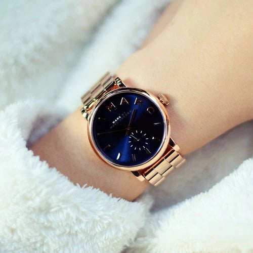 Marc By Marc Jacobs Baker watch worn on wrist, showing navy dial with rose gold indices