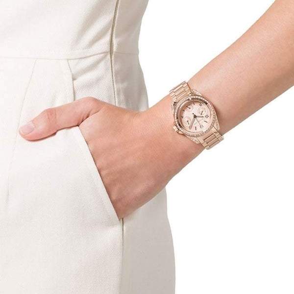 Michael Kors Blair multi-function watch worn on wrist with rose dial visible