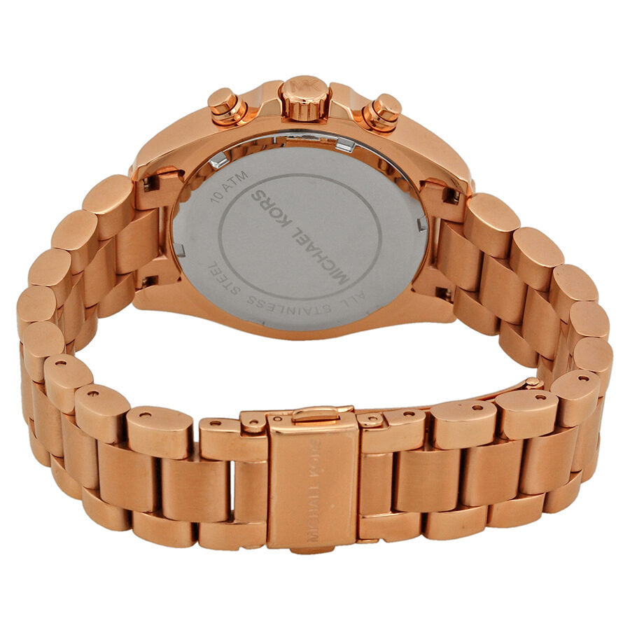 Michael Kors Bradshaw watch caseback showing rose gold stainless steel back and chronograph pushers