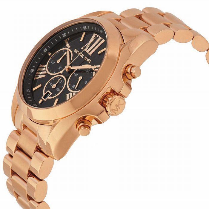 Michael Kors Bradshaw watch angled view showing rose gold case, bracelet, and chronograph subdials