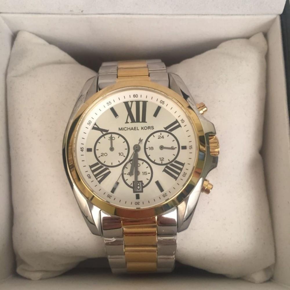 Michael Kors Bradshaw watch displayed in retail packaging box with documentation