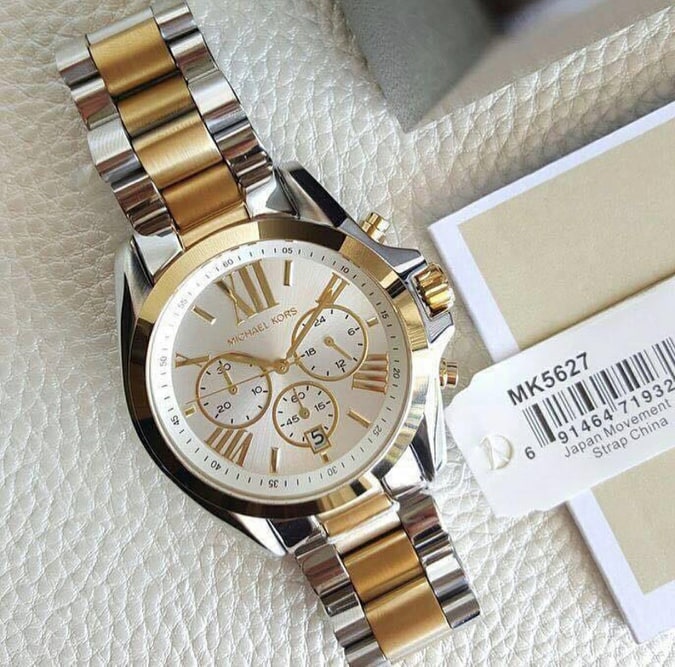 Michael Kors Bradshaw watch with product label and two-tone stainless steel bracelet detail