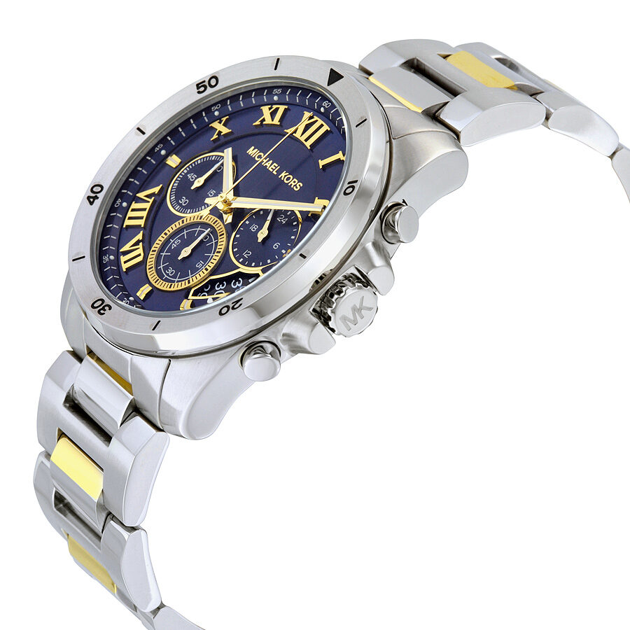 Michael Kors Brecken chronograph watch at angle showing blue dial and two-tone silver and gold bracelet