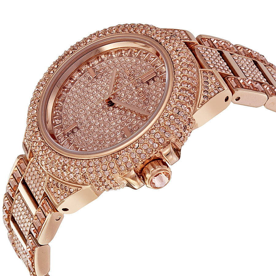 Angled side view of Michael Kors Camille watch showing crystal-covered case and rose gold bracelet